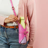 A yellow water bottle in a bright pink leather bottle carrier bag, modelled across the body.