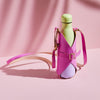 A yellow water bottle in a bright pink leather bottle carrier bag with personalised initials and a long shoulder strap.