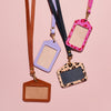 Four personalised leather lanyards with ID badge holders in brown, lilac, leopard print and fuchsia pink