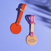 Pink and orange leather luggage tags