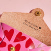 A personalised Valentine's Day message printed inside a pink leather purse
