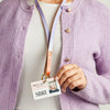 A lilac and orange leather lanyard, shown modelled with an ID card - Sbri